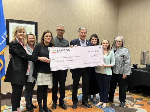Members of the Lawton Business Women’s Club and a representative of the Lawton Community Foundation are shown with a replica check representing a recent donation to the club’s endowed scholarship fund with the foundation. From the left are LBW members Yvonne Landmark, Kim Thomas and Jennifer Ellis; Lawton Community Foundation representatives Hossein Moini and Gene Love; and LBW members Nita Russell, Dani Blackburn and Dana Parrish. KYLETTA RAY | SOUTHWEST LEDGER