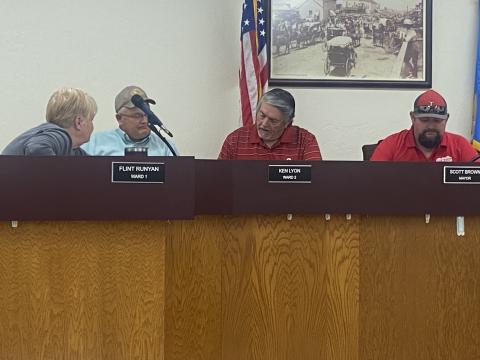 From the left, Cache City Clerk/Treasurer speaks with Cache City Councilman Flint Runyan while Councilman Ken Lyon and Mayor Scott Brown prepare for the council’s April 10 meeting. The council voted to take no action on an executive search agreement with Oklahoma Municipal Management Services for recruiting a new police chief. ERIC SWANSON | SOUTHWEST LEDGER