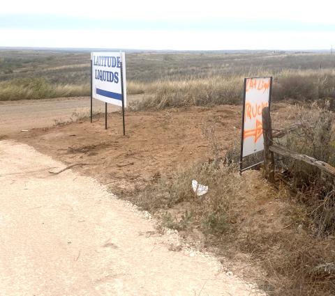 Signs point the way to an unimproved Latitude Liquids storage site discovered near Shamrock, Texas, in the Panhandle. PHOTO PROVIDED