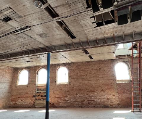 A construction crew has removed asbestos-laced material from the ceiling in the Savoy Hotel building in downtown Chickasha, in preparation for installation of copper tin tiles. In addition, the brick walls in the 121-year-old building have been cleaned to expose their natural state. MIKE W. RAY | SOUTHWEST LEDGER