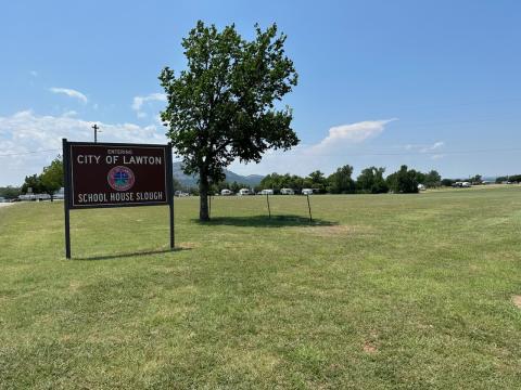 The sign for School House Slough is shown in this photo taken July 5. The Lawton City Council recently approved a draft version of a request for proposals from entities interested in taking over the concessionaire lease for School House Slough, a concession area on the east shore of Lake Lawtonka. CURTIS W. AWBREY | SOUTHWEST LEDGER