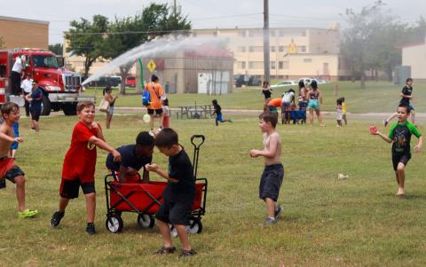 A passel of youngsters found a perfect way to cool off in the searing summer heat, by hurling 5,000 water-filled balloons at each other during the Summer Daze event recently on Fort Sill. SGT. TYLER YOUNT | U.S. ARMY