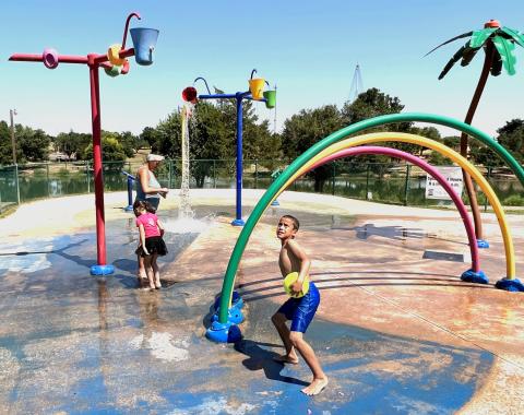 Veronica Lawrence of Chickasha joins Kravitz Lawrence, 9, and Lillian Lake, 6, in cooling off at the Shannon Springs Park splash pad Aug. 10. The City Council authorized Parks and Recreation Director Spencer Winzenried to spend $5,218 to replace two bushings, six O-rings and two spray cannon fixed heads at the splash pad. Chickasha’s splash pads were constructed in 2007. “They have outlived their life expectancy and are starting to break down,” Winzenried said. MIKE W. RAY | SOUTHWEST LEDGER