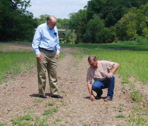Former state legislators Jerry Ellis, left, and Brian Renegar examine the dry Kiamichi riverbed near Clayton during a drought in 2011-12. PROVIDED
