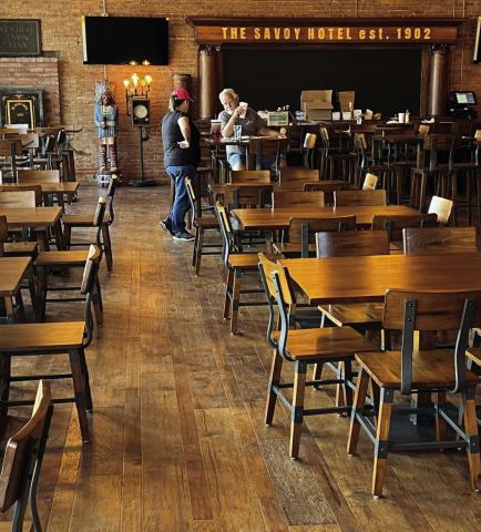 The Savoy dining room can seat perhaps 80 patrons, owner Chet Hitt estimates. The antique bar in the background had been adorned with “The Savoy Hotel est. 1902” hand-painted in gold leaf by Carrie Chavers, a retired Chickasha art teacher. Mike W. Ray | Southwest Ledger