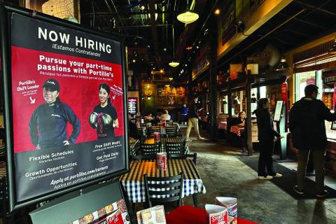 A hiring sign displayed at a restaurant in Skokie, Ill., Wednesday, Jan. 8, 2025. Nam Y. Huh | Associated Press