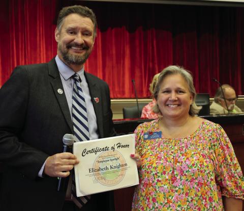 Lawton City Manager John Ratliff presents the Employee Spotlight Award to Librarian Elizabeth Knighton. DaLynna Wood | City of Lawton