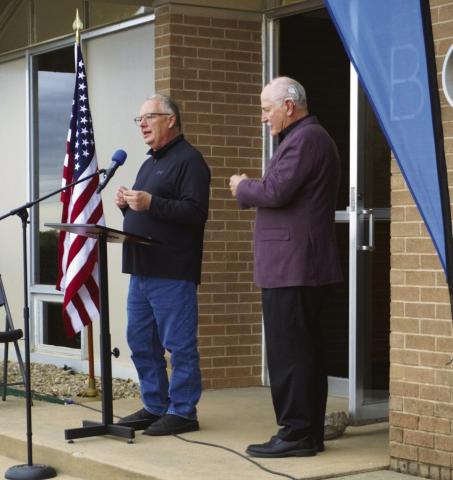From the left, Building Chairman Max Sasseen addresses the audience as Mayor Stan Booker looks on. Eric Swanson | Southwest Ledger
