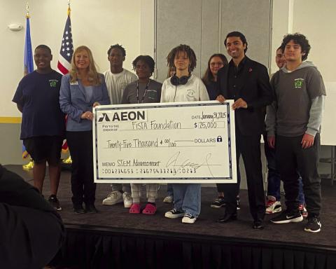 Eric Swanson | Southwest Ledger From the left, FISTA President and CEO Dr. Krista Ratliff and Firehawk Aerospace CEO Will Edwards hold a replica of a $25,000 check during a Jan. 31 ceremony at Central Plaza. Ratliff and Edwards were joined by students enrolled in the MIGHT Technology and Learning Center, as well as Lawton Mayor Stan Booker.