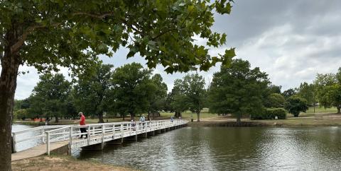 Curtis W. Awbrey | Southwest Ledger A family spends Sunday afternoon fishing off the side of the pedestrian bridge at Chickasha’s Shannon Springs Park. The bridge was built at least 77 years ago and its concrete piers show their age, Parks and Recreation Director Spencer Winzenried said.