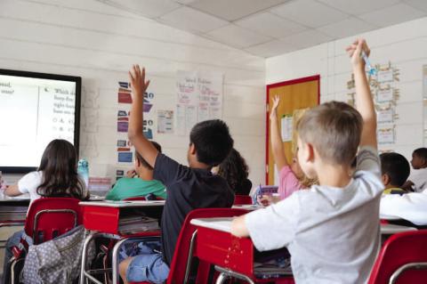 Third grade students from Bishop Elementary raise their hands during a lesson in mathematics. Ashley Payne | Southwest Ledger