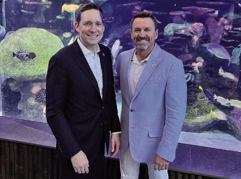 Provided From the left, Oklahoma Lt. Gov. Matt Pinnell and Jenks Mayor Cody Box visit the Oklahoma Aquarium. The aquarium is home to the world’s largest collection of bull sharks. Box is scheduled to swim with the sharks to raise funds for student education.