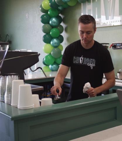 Charged Cafe co-owner Paul Jewell works behind the counter during the coffee shop’s Oct. 4 grand opening. The store specializes in craveable coffee drinks and energy teas. Eric Swanson | Southwest Ledger