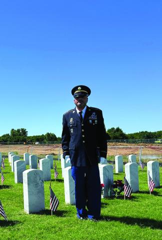 MSGT Kenneth Fairley (Ret.) walks among the headstones of the Fort Sill National Cemetery near Elgin after the Memorial Day service Monday. More than 10,000 service members and family members are interred at the cemetery. Curtis W. Awbrey | Southwest Ledger