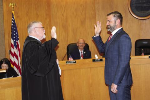 From the left, Duncan Municipal Judge Joe Enos administers the oath of office to Duncan City Councilman-Elect David Leonard on May 5 in the council’s chambers at the Duncan Police Department. City of Duncan