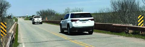 Mike W. Ray | Southwest Ledger Northbound vehicles cross one of the two aged, narrow, and nearly identical bridges on South 11th Street between Interstate 44 and Southwest Pecan Road on March 26, 2024. Both bridges will be closed April 1 for eight months while new 32-foot-wide bridges are built, Lawton City Councilman George Gill announced. One structure spans Wolf Creek, and the other straddles a tributary. Traffic to the city’s landfill will be rerouted during construction.