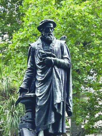 Photo by James Finck, Ph.D. This London statue of William Tyndale (circa 1495-1536) shows the English Bible publisher who would be put to death for his religious ideas.