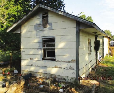 This is one of two structures at 908 NW Bell Ave. in Lawton that were condemned recently by the City Council as being dangerous and dilapidated. The house, which “is not habitable,” and this storage building constitute a blight because both are in an “obvious state of neglect and disrepair,” said Neighborhood Services Supervisor Josh White. City of Lawton