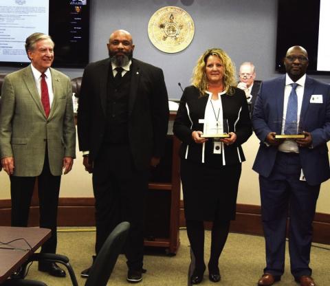Presented with a special Customer Service award for talking a distraught man from self harm in November 2021 were Daniel Parker, right, and Charissa King, second from right. Also present for the ceremony were Turnpike Authority board member Gene Love of Lawton, left, and Marcus Williams, OTA Director of Customer Service, second from left. Oklahoma Turnpike Authority