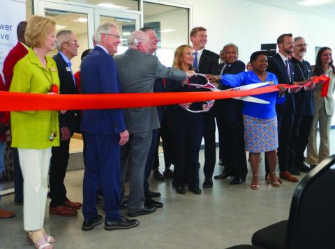 Eric Swanson | Southwest Ledger From the left, Lawton City Council member Linda Chapman, FISTA Development Trust Authority Chairman Mark Brace, Mayor Stan Booker, FISTA President/CEO Dr. Krista Ratliff, and Lawton City Council members Allan Hampton and Sherene Williams join Epirus representatives and Lawton-Fort Sill Chamber of/ Commerce ambassadors in cutting the ribbon for Epirus’ new Immersive Innovation Center.