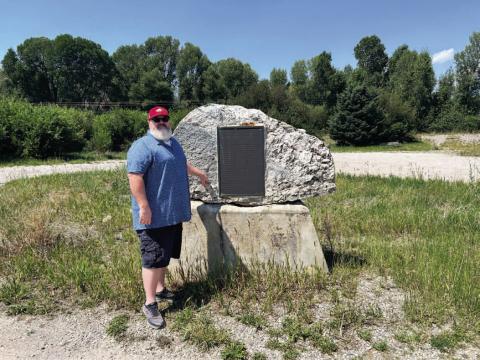 James Finck stands beside a historical marker which tells of the 1832 rendezvous at Pierre’s Hole in the Teton Mountain Range. Located near present-day Driggs, Idaho, the historic site was a central point for mountain men, traders, and Native Americans of the American frontier. James Finck, Ph.D. | For Southwest Ledger