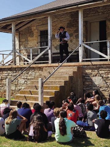 Photo courtesy of Fort Sill An actor portraying a Territorial U.S. Marshal describes to a group of youngsters visiting Fort Sill what life was like while serving on the Plains in the ‘Old West.’ F. Lee Reynolds, chief of the Engagements Division and Strategic Communications Officer of the U.S. Army Center of Military History, told Southwest Ledger last Wednesday that the Fort Sill National Historic Landmark and Museum “is slated to close entirely pending final approval of the plan.”