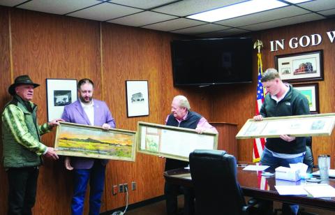 Eric Swanson | Southwest Ledger Kim Wayne Shahan, founder and president of Vision of Hope/Camp Y’Shua, and Comanche County Commissioners Josh Powers, Johnny Owens and Ryan John hold frames containing items related to Shahan’s research about Tarbone Mountain. Shahan made his presentation about the mountain, which has been renamed as Tah-bone-mah Mountain, during the commissioners’ March 10 meeting.
