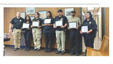Eric Swanson | Southwest Ledger From the left, Comanche County Detention Center Administrator David Weber is shown with jail staffers Zoshsha Hamilton, Jennifer Diaz, Tynesia Mabon, Thomas LeBlanc, Gregory Mucker and Michelle Barlow during the Comanche County Facilities Authority’s July 28 meeting. The six employees were honored for their performance during a July 16 critical incident at the jail.