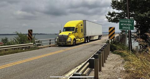 A westbound 18-wheeler crosses the narrow two-lane Roosevelt Memorial Bridge on U.S. Highway 70 just east of Kingston. Oklahoma Dept. of Transportation received a $124M grant from the federal government to help replace the 80-year-old bridge honoring the 32nd U.S. President Franklin Delano Roosevelt with a four-lane bridge that will also cross Lake Texoma, ODOT reported earlier this month. Curtis W. Awbrey | Southwest Ledger