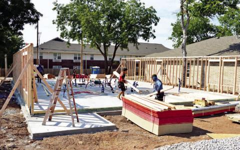 Stephen Robertson | For Southwest Ledger A crew works on a new home under construction in the 900 block of Southwest D Avenue in downtown Lawton.
