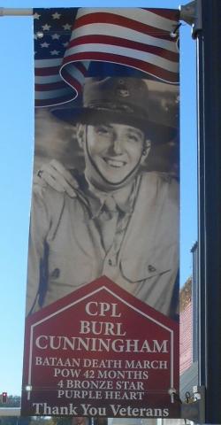 Provided This banner suspended from a light pole in Valliant, Oklahoma, in McCurtain County, honors the late Cpl. Burl Cunningham, a World War II POW who survived the Bataan Death March.