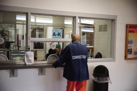 An aging prisoner at the Joseph Harp Correctional Facility in Lexington receives medication on Oct. 10, 2024. Oklahoma’s elderly prisoner population continues to rise despite reforms aimed at streamlining medical parole and compassionate release. Keaton Ross | Oklahoma Watch