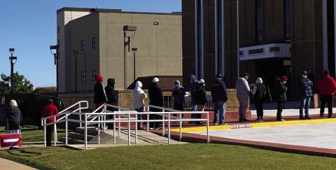 Early voters wait in line at the Comanche County Courthouse in Lawton to cast in-person absentee ballots prior to the Nov. 3, 2020, general election. This year, early voting for those who normally vote at the courthouse will instead be at the Great Plains Fairgrounds Annex Building for the Nov. 5 general election. File