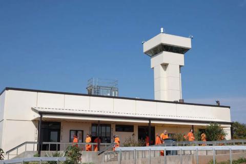 Brent Fuchs | Oklahoma Watch Prisoners move around the Joseph Harp Correctional Center. They will soon be allowed to purchase nicotine vapes and pouches.