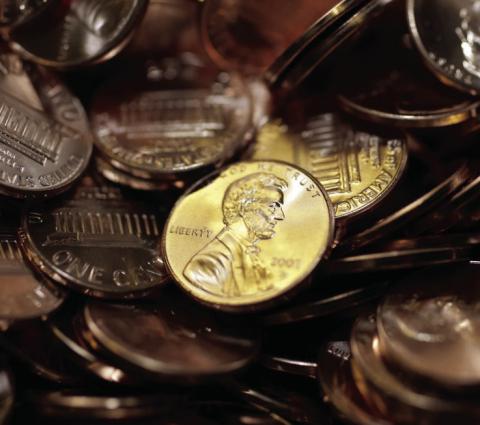 AP Photo | David Zalubowski, File Freshly made pennies sit in a bin at the U.S. Mint in Denver on Aug. 15, 2007.