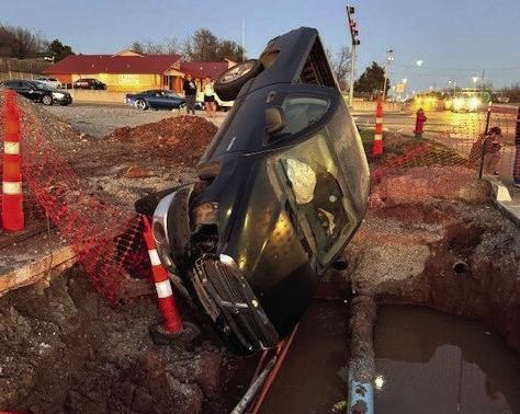 David B. Hale | Southwest Ledger A traffic collision in Lawton at 38th Street and Gore Boulevard on March 11 resulted in this pickup nose down in a hole and one person transported to a hospital with minor injuries, the Lawton Police Department reported. Public Utilities Director Rusty Whisenhunt said the pit was excavated by a contractor in order to bore a hole for a new water line across Gore.