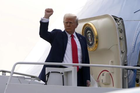 AP photo | Mark Schiefeibein, Pool President Donald Trump gestures as he boards Air Force One en route to Florida at Harry Reid International Airport in Las Vegas, Saturday, Jan. 25,2025.