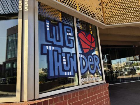 Art in the window of Dust Bowl Lanes and Lounge in Oklahoma City, pictured April 10, 2025, celebrates the Oklahoma City Thunder ahead of playoff games. Emmas Murphy | Oklahoma Voice