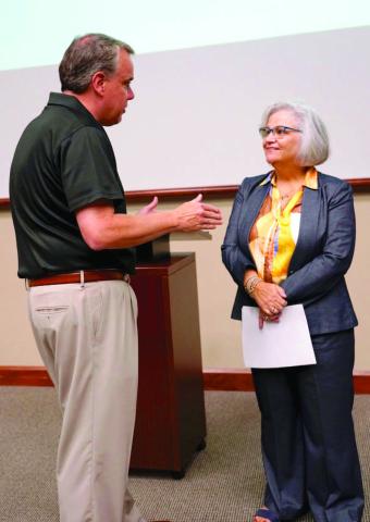 Cameron University President Shane Hunt, left, speaks with forum organizer Brenda Spencer-Ragland during the Homeless Encampment Community Action Forum Thursday at Cameron University. Hannah Owens | Southwest Ledger