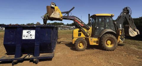 Cody Diaz, an employee of the Chickasha Street Department, unloads some debris for a Chickasha resident May 16 during the city’s annual Spring Clean-Up event. Curtis W. Awbrey | Southwest Ledger