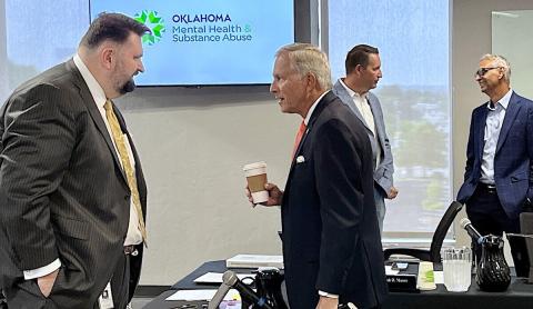 Commissioner Greg Slavonic Commissioner of Mental Health Greg Slavonic, center, speaks with Chairman Hamel Reinmiller ahead of the Oklahoma Department of Mental Health and Substance Abuse Services Board meeting Friday, July 18, 2025. Tres Savage | NonDoc